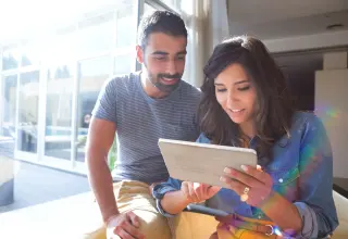 Young couple on tablet