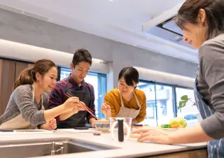 people around table eating