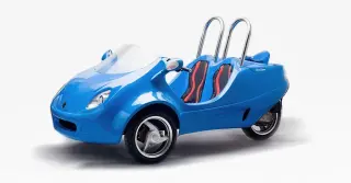 A blue two-seater car with a compact design and red seats.