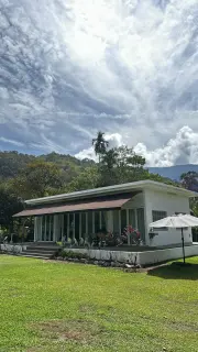Tanalui exterior on an open lawn