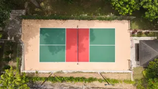 Drone view of the pickleball court among the trees