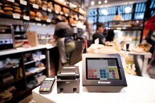 Customer paying at a POS terminal