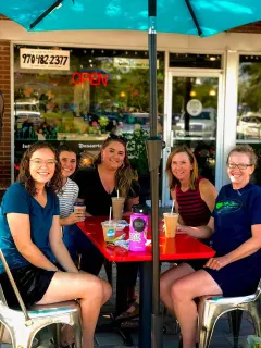 Ladies enjoying outdoor seating.