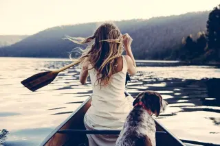 Canoe woman dog