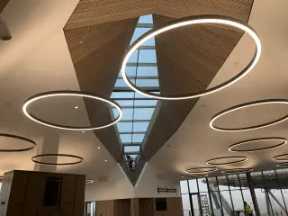 Splayed angle ceiling working up to 10m from the ground at Cranfield University - Looking up out of the glass ceiling nearly completed